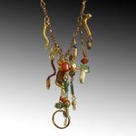 #178
Lapus lazuli, coral, agate, quartz, nut, recycled bottle glass, sea glass, copper, brass.
17.5"w with 3" drop
